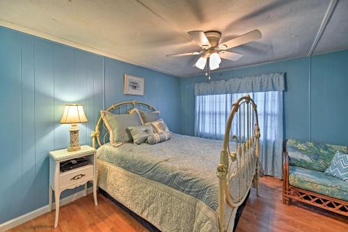 a bedroom with a bed and a ceiling fan at Salter Path Home-Short Walk to Indian Shores and Bay in Salter Path