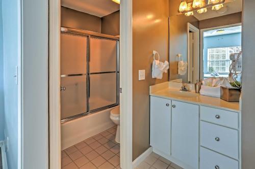 a bathroom with a toilet and a sink and a shower at 10 Mi to Beach Legends Resort Condo on Ninth Hole in Myrtle Beach
