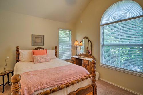 a bedroom with a bed and a large window at 2 Furnished Decks and Lake Views Austin Escape in Austin