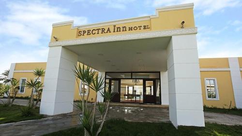 a yellow building with a sign that reads sprecaria inn house at Spectra Inn Hotel in Cairo