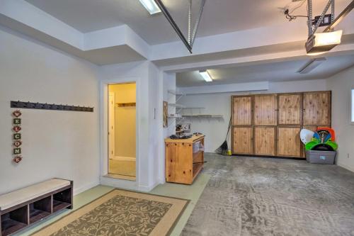 a large room with a table and wooden doors at Beech Mountain Retreat with Open Deck 2 Mi to Ski! in Beech Mountain