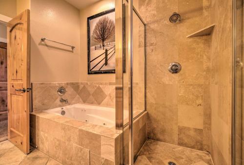 a bathroom with a tub and a glass shower at Mammoth Lakes Townhome - 10-Min Walk to Village! in Mammoth Lakes