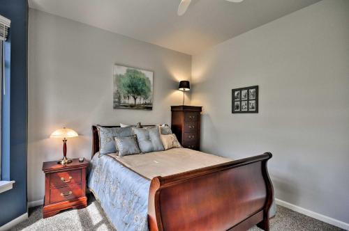 a bedroom with a bed with a dresser and a lamp at Modern Vancouver Townhome - Right on Main St! in Vancouver