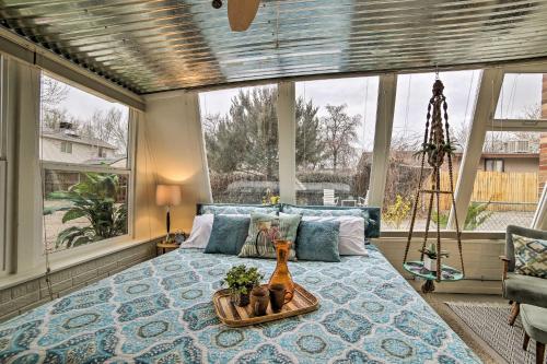 a bedroom with a bed with a tray on it at Cozy Grand Junction Bungalow by Trails and Wineries! in Grand Junction