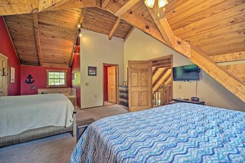 a bedroom with a bed and a wooden ceiling at Cherokee Lake Cabin with Deck and Kayaks! in Bean Station
