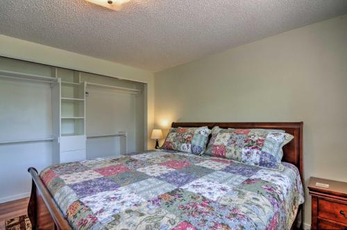 a bedroom with a bed with a quilt on it at Cottage Near Bryce Canyon and Zion National Parks! in Cannonville