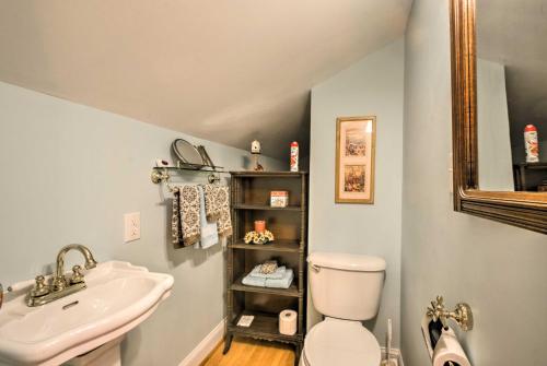 a bathroom with a sink and a toilet and a mirror at Damascus Home with Fire Pit and Views, Walk to Shops! in Damascus