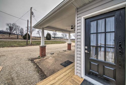 a front door of a house with a garage at Lakefront Studio Guest Home on Hermann Wine Trail! in New Haven
