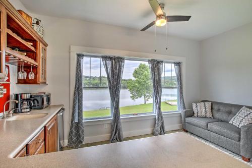 a kitchen with a couch and a large window at Lakefront Studio Guest Home on Hermann Wine Trail! in New Haven