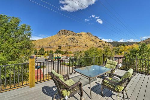 a patio with chairs and a table on a deck at Central Lava Hot Springs Studio with Deck and Views! in Lava Hot Springs