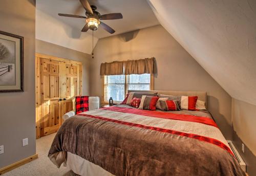 a bedroom with a bed and a ceiling fan at Secluded Conway Home with Theater Room and Hot Tub! in Conway