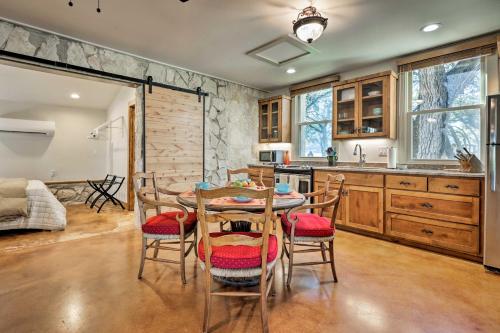 a kitchen and dining room with a table and chairs at Blanco Riverfront Historic Home, 3 Mi to Downtown! in Blanco