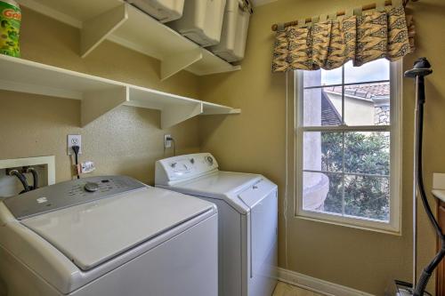 a laundry room with a washing machine and a window at Luxe San Diego Getaway with Pool and Ocean Views in San Diego