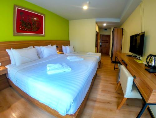 En eller flere senger på et rom på Siri Oriental Bangkok Hotel