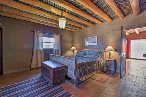 a bedroom with a large bed and a window at El Prado Adobe Home Courtyard with Mountain Views! in El Prado