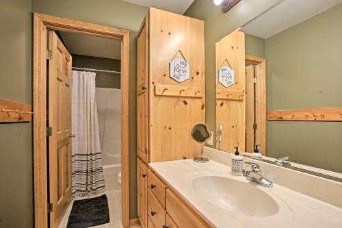 a bathroom with a sink and a shower and a tub at Waterfront Fife Lake Cottage Dock, Kayak, Sunroom in Fife Lake