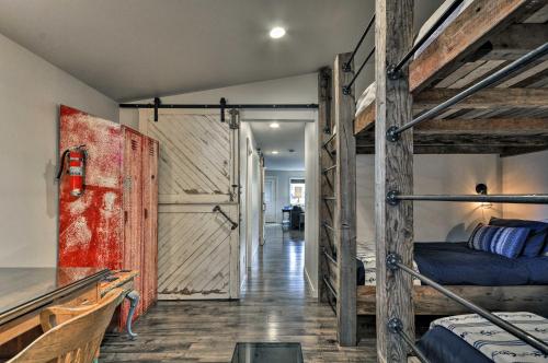 a room with two bunk beds and a hallway at Sleek Riverfront Condo on Pier in Downtown Astoria in Astoria, Oregon