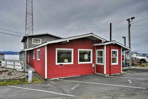 a small red building in a parking lot at Sleek Riverfront Condo on Pier in Downtown Astoria in Astoria, Oregon