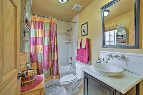 a bathroom with a sink and a toilet at Rustic Cabin Near Palisade State Park with Deck! in Manti