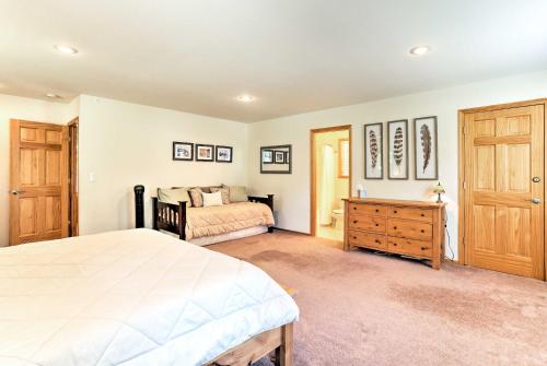 a bedroom with a bed and a dresser in it at Forest Views and Beach Access Family Truckee Gem in Truckee