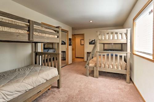 a bedroom with two bunk beds and a window at Forest Views and Beach Access Family Truckee Gem in Truckee