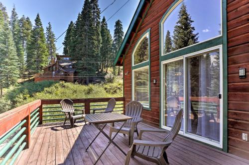a deck with a table and chairs on a cabin at Forest Views and Beach Access Family Truckee Gem in Truckee