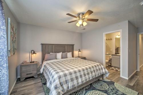 a bedroom with a bed and a ceiling fan at Cozy Condo with Pool Access in the Heart of Branson! in Branson