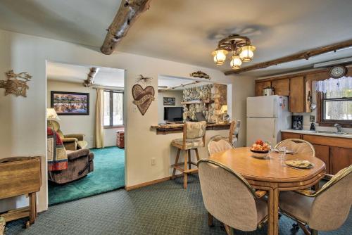 a kitchen and a dining room with a table in a room at Cabin Near to Lakes, ATVing, Skiing and Natl Forest in Pound