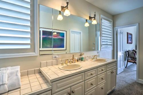 a bathroom with two sinks and a large mirror at 4 Mi to Skiing Breckenridge Mountain Retreat! in Breckenridge