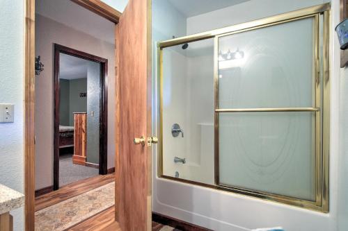 a glass shower door in a bathroom at Vintage House with Fire Pit Less Than 6 Mi To Kentucky Lake! in New Concord