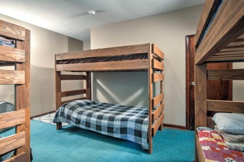 a bunk bed in a room with two bunk beds at Vintage House with Fire Pit Less Than 6 Mi To Kentucky Lake! in New Concord