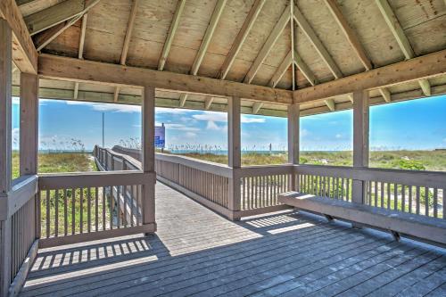 a wooden porch with a view of the beach at Amelia Island Condo with Pool and Beach Access! in Amelia Island