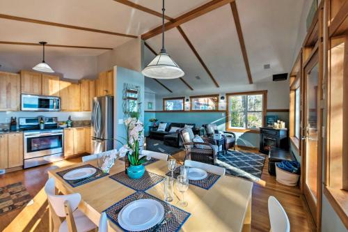 a kitchen and living room with a table and chairs at Puget Sound Escape Private Beach and Oversized Deck in Kingston
