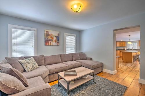 a living room with a couch and a table at Warrensburg Home about 6 Mi to Lake George! in Warrensburg