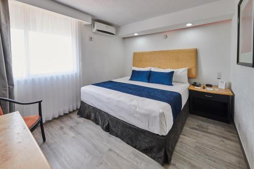 Postel nebo postele na pokoji v ubytování Best Western Plus Gran Hotel Centro Historico