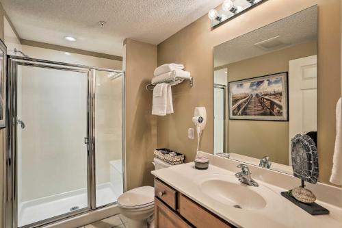 a bathroom with a shower and a sink and a toilet at Resort Pool, Gym & Hot Tub: Beachfront PCB Condo! in Panama City Beach