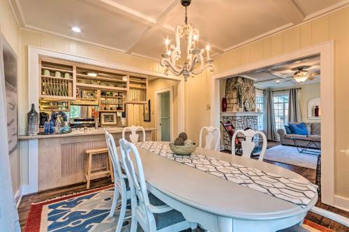 a kitchen and dining room with a table and chairs at 2 Mi to Hot Springs Natl Park Hot Tub Haven! in Hot Springs