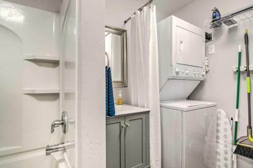 a white bathroom with a sink and a shower at Colorado Springs Bungalow - Walk to Downtown! in Colorado Springs