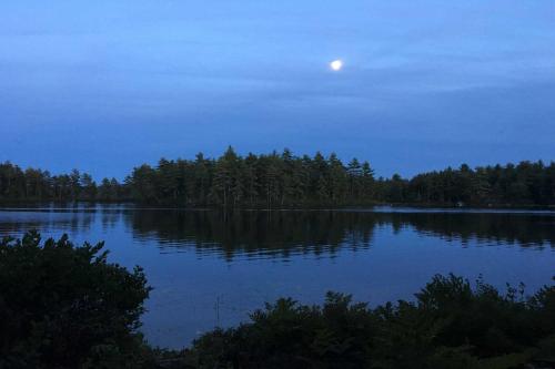a view of a lake at night with the moon at Waterfront Conway Vacation Rental with Deck! in Conway