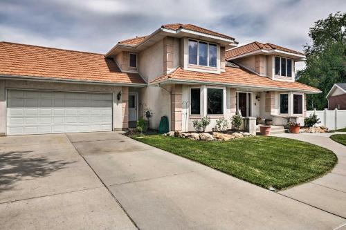 a house with a driveway and a garage at Under the Sea and Ski Apt with View, Near Dwtn in Salt Lake City
