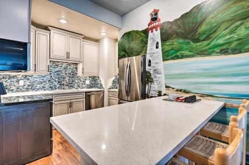 a kitchen with a lighthouse mural on the wall at Under the Sea and Ski Apt with View, 7 Mi to Dwtn in Salt Lake City