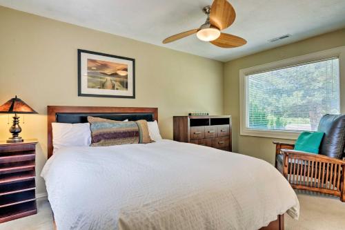 a bedroom with a bed and a ceiling fan at Salt Lake City Home with Koi Pond and Furnished Deck! in Salt Lake City