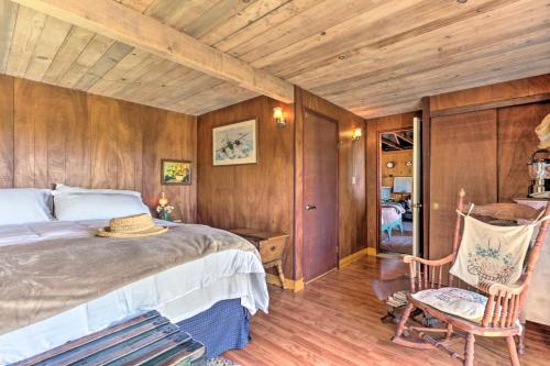 a bedroom with a large bed and wooden walls at Moonview Ranch on 20 Acres in Sonoma County! in Sebastopol
