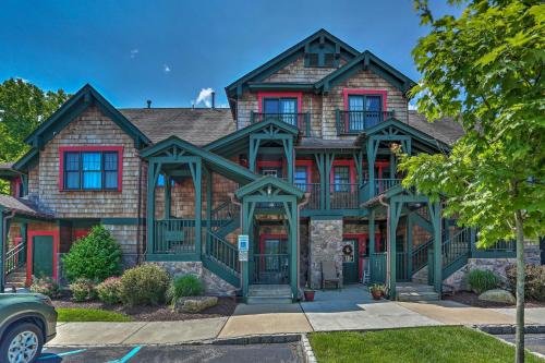 a large house with a green at Mountain Creek Resort Home - Hot Tub and Pool Access in Vernon Township