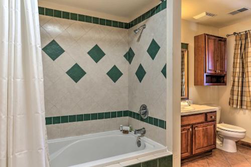 a bathroom with a bath tub and a toilet at Mountain Creek Resort Home - Hot Tub and Pool Access in Vernon Township