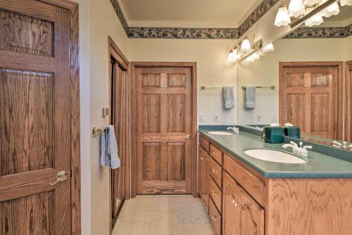 a bathroom with a sink and a mirror at Large Salida Home with Mtn Views - 2 Mi to Downtown! in Salida