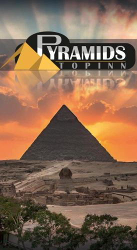 an image of the pyramids of giza at sunset at Pyramids Top Inn in Cairo
