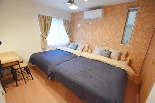 Cama o camas de una habitación en FINOA Residential Suite Asakusa/Oshiage Skytree