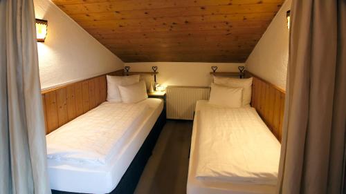 Un ou plusieurs lits dans un hébergement de l'établissement Appartement Elisabeth