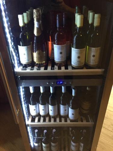 a refrigerator filled with lots of bottles of wine at Hotel Taurus in Ostrava